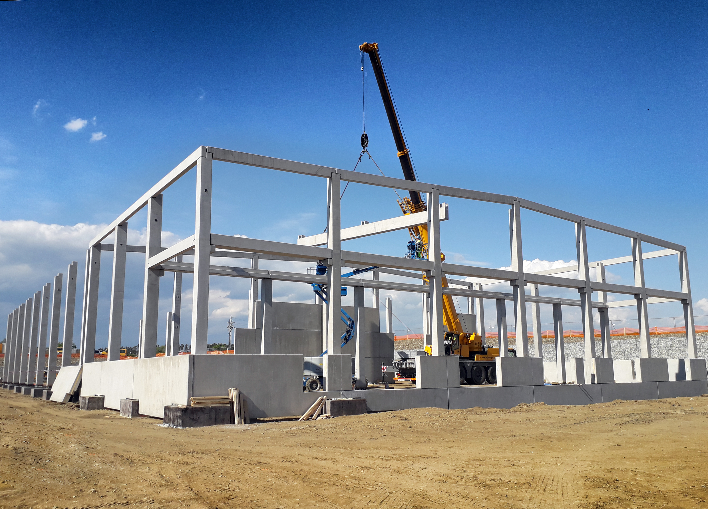 Outside view of hall construction with crane